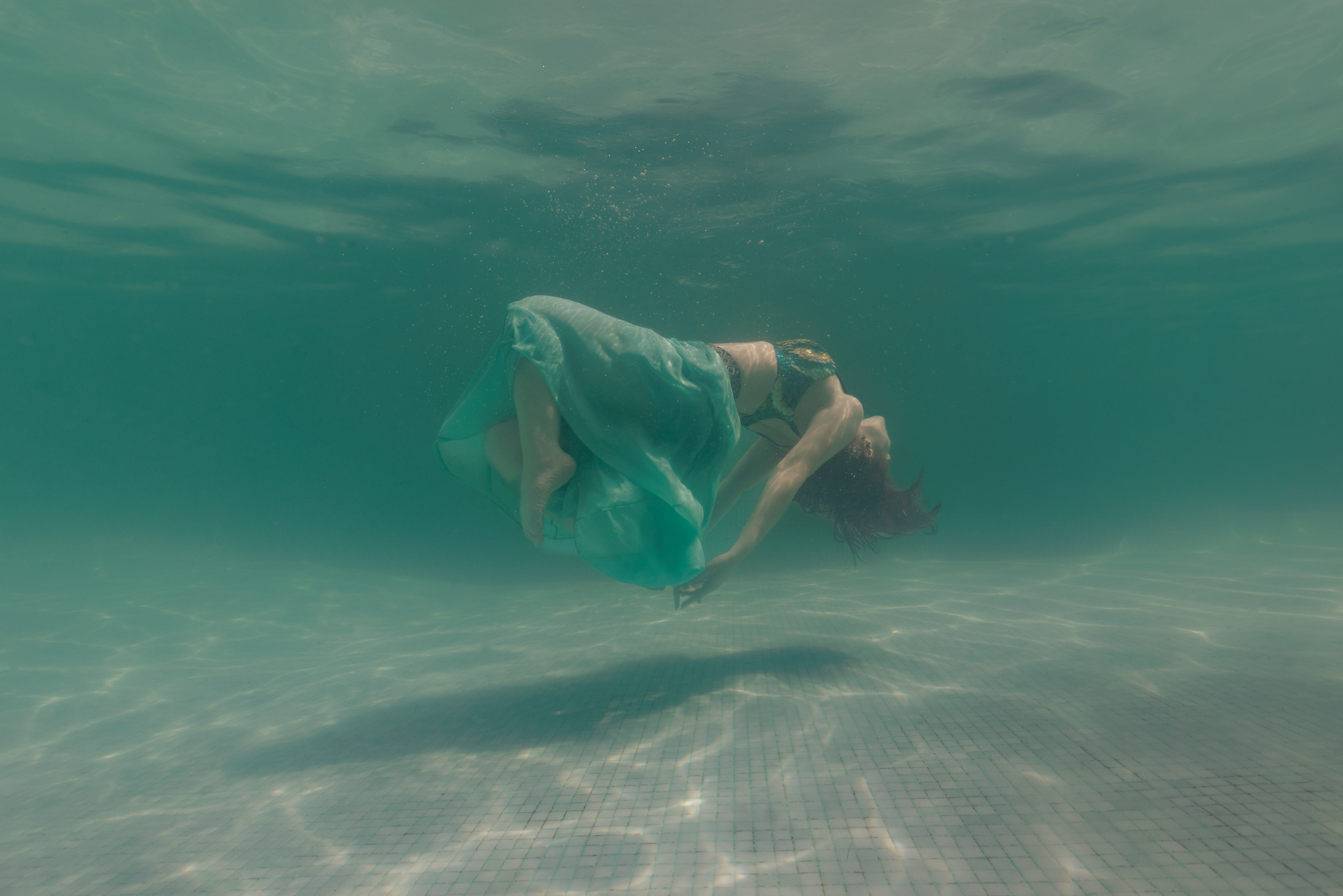 A person floating underwater